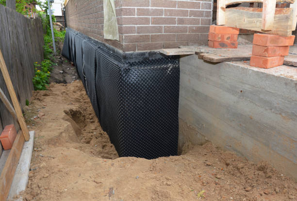 SJ Waterproofing Pros team waterproofing a large commercial structure in USA